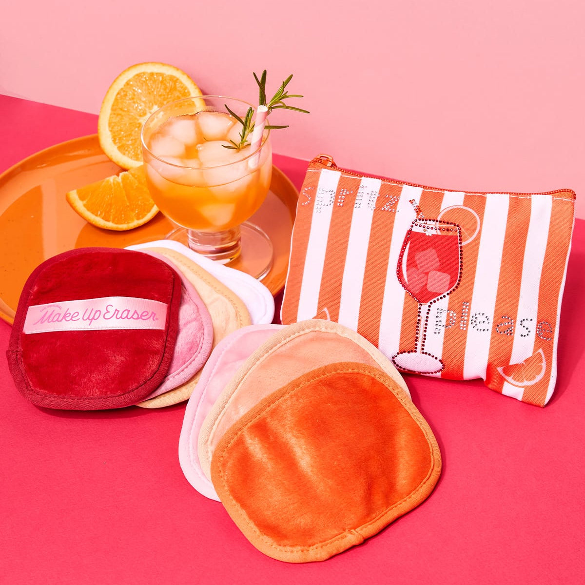 Makeup removal pads with a pouch on a pink background