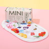 Mini Wildflowers MakeUp Eraser packaging on top of cloth.