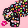 7 daily MakeUp Erasers, 1 hair claw clip, & 1 reusable makeup bag on a pink background