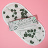 Eucalyptus Print MakeUp Eraser packaging on top of a Eucalyptus Print MakeUp Eraser.