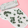 Eucalyptus Print MakeUp Eraser packaging next to folded Eucalyptus Print MakeUp Eraser.