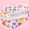 Wildflowers Print MakeUp Eraser packaging on top of folded Wildflower MakeUp Eraser.