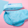 Chill Blue MakeUp Eraser packaging next to folded Chill Blue MakeUp Eraser.