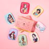 Ultimate Disney Princess 7-Day Set MakeUp Eraser cloths laying in a circle next to packaging. 