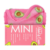 Rolled up Mini Avocado MakeUp Eraser cloth on top of packaging. 