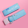 Front of Chill Blue MakeUp Eraser packaging next to the back of Chill Blue MakeUp Eraser packaging. The back of the packaging is open with a rolled-up Chill Blue MakeUp Eraser peeking out.
