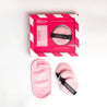 THE DUO: Mini MakeUp Eraser + THE PUFF packaging next to Mini Pink MakeUp Eraser cloth and The PUFF cloths.