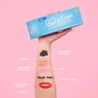 Hand holding Chill Blue MakeUp Eraser packaging. There is writing on the arm that calls out the various makeup that MakeUp Eraser can remove.