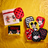 Mickey & Minnie 7-Day Set packaging next to laundry bag and cloths.