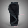 Rolled up Chic Black MakeUp Eraser with both sides exposed. The short fiber side is labeled as erase, and the long fiber side is labeled as exfoliate.